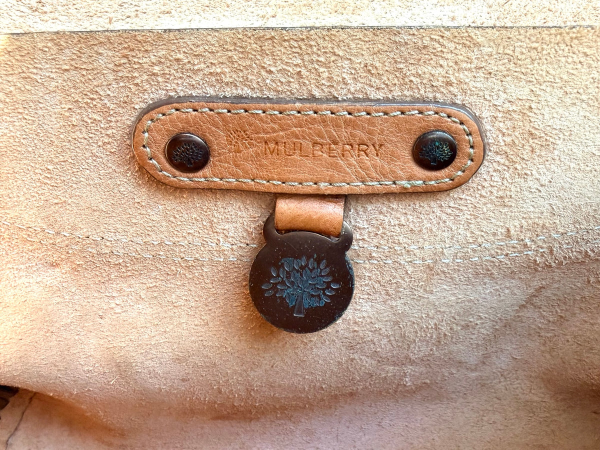 Mulberry interior branding and tree emblem
