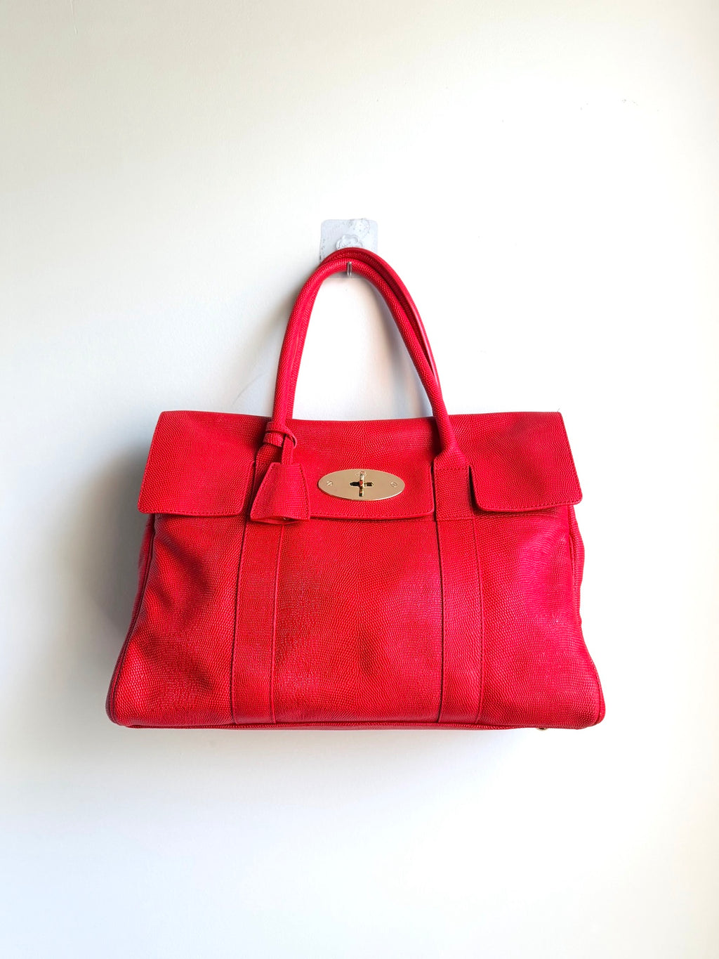 Front view of fire-engine red Mulberry Bayswater in lizard-embossed leather with gold-tone Postman's Lock