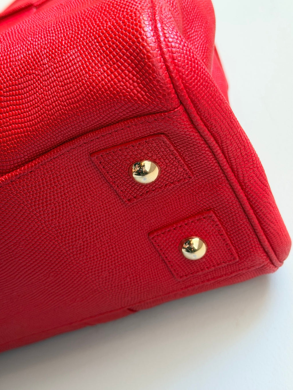 Close-up of bottom corner and protective metal feet of Mulberry Bayswater